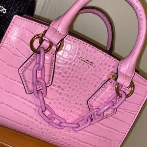 Pink faux crocodile mini bag.